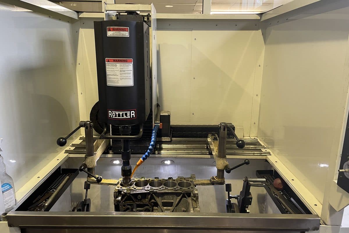 Engine block being bored on a Rottler CNC machine